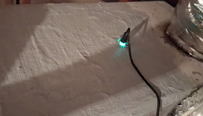 HVAC UV light installed inside an attic air duct system.